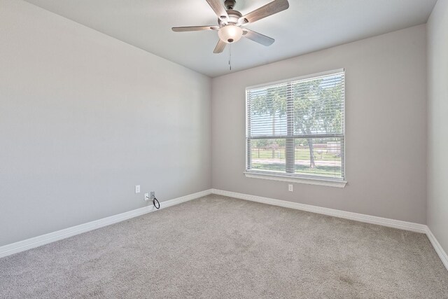 103 W Tomlinson St, Florence, TX 76527 - unfurnished room featuring carpet floors and a ceiling fan