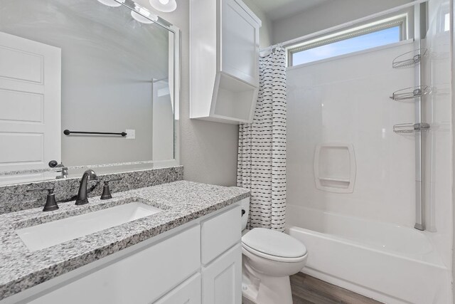 103 W Tomlinson St, Florence, TX 76527 - full bath with vanity, shower / bath combination with curtain, and wood finished floors