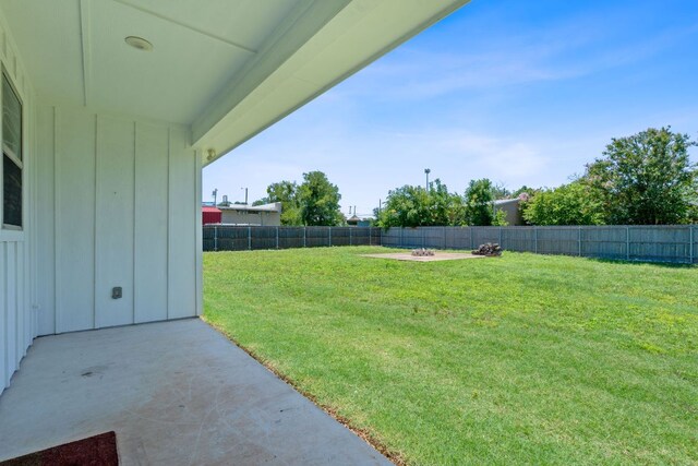 103 W Tomlinson St, Florence, TX 76527 - fenced backyard with a patio area and a fire pit