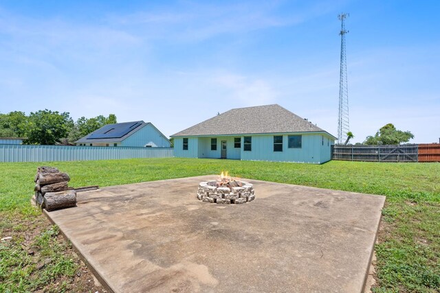 103 W Tomlinson St, Florence, TX 76527 - fenced backyard featuring an outdoor fire pit and a patio
