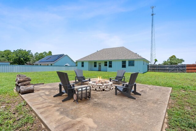 103 W Tomlinson St, Florence, TX 76527 - fenced backyard featuring an outdoor fire pit and a patio area