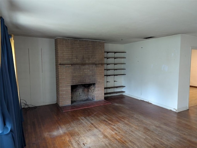 606 Scurry St, Austin, TX 78753 - unfurnished living room with wood-type flooring and a fireplace