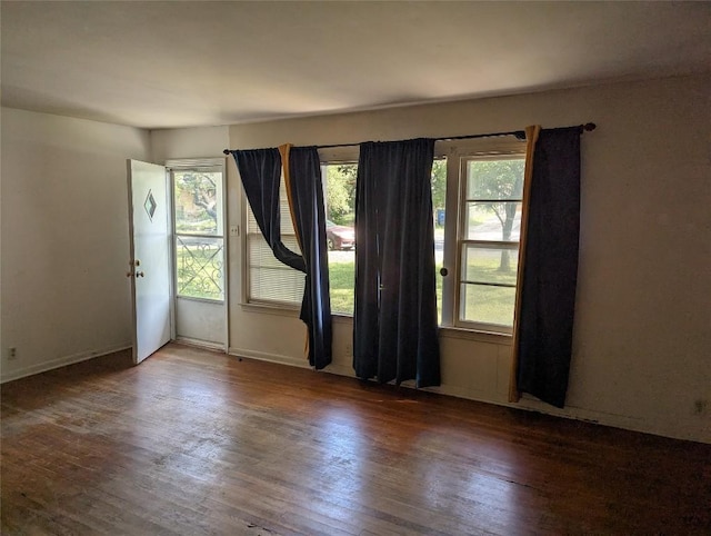 606 Scurry St, Austin, TX 78753 - spare room with healthy amount of natural light and wood finished floors