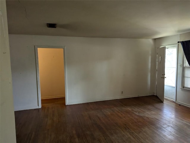 606 Scurry St, Austin, TX 78753 - spare room with wood-type flooring and baseboards