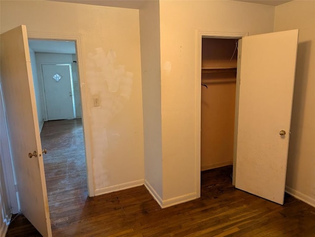 606 Scurry St, Austin, TX 78753 - unfurnished bedroom featuring wood finished floors and a closet