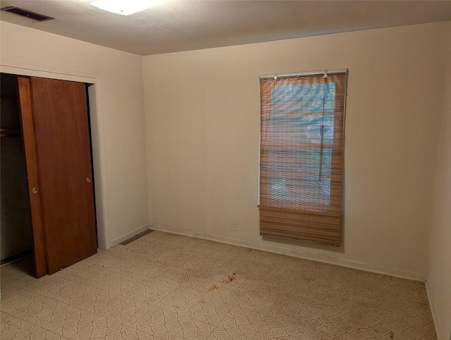 606 Scurry St, Austin, TX 78753 - unfurnished bedroom featuring a closet and baseboards