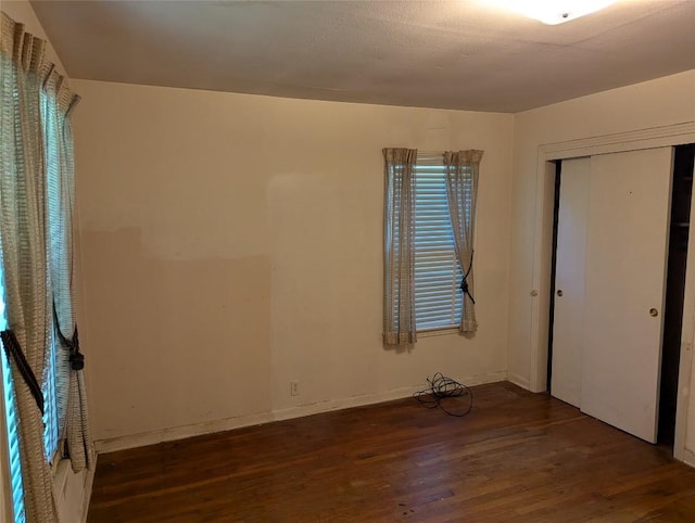 606 Scurry St, Austin, TX 78753 - unfurnished bedroom with wood finished floors and a closet