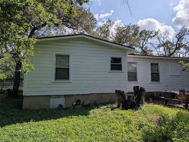 606 Scurry St, Austin, TX 78753 - view of side of home featuring a yard