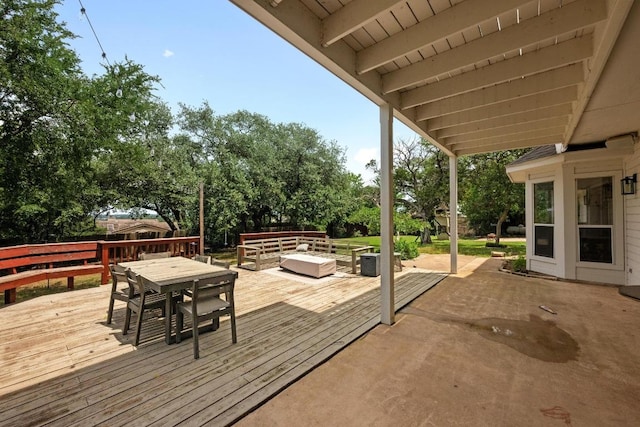 707 Malabar St, Lakeway, TX 78734 - wooden terrace featuring outdoor dining area, view of wooded area, and an outdoor hangout area