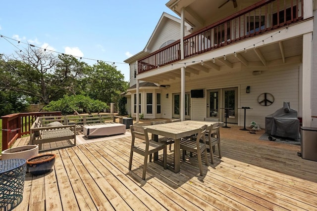 707 Malabar St, Lakeway, TX 78734 - wooden terrace featuring grilling area, outdoor dining space, and an outdoor living space