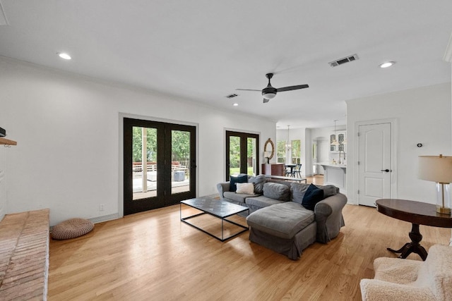 707 Malabar St, Lakeway, TX 78734 - living area with light wood-type flooring, french doors, a ceiling fan, recessed lighting, and crown molding