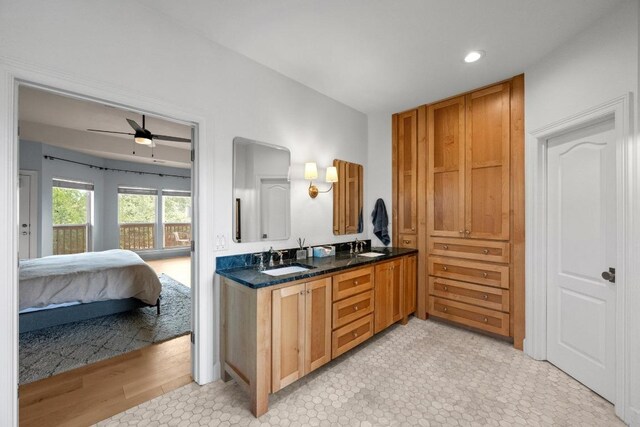 707 Malabar St, Lakeway, TX 78734 - bathroom featuring double vanity, ensuite bath, a ceiling fan, and recessed lighting