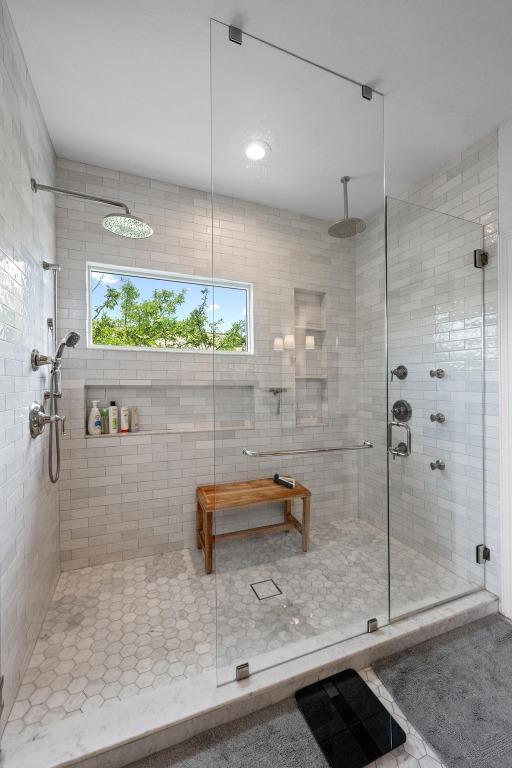 707 Malabar St, Lakeway, TX 78734 - full bath with a stall shower and plenty of natural light