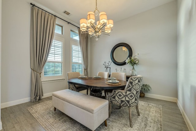 2800 Crystal Falls Pkwy, Leander, TX 78641 - dining area with wood finished floors and a chandelier