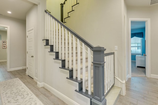2800 Crystal Falls Pkwy, Leander, TX 78641 - stairs with wood finished floors and recessed lighting