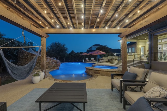 2800 Crystal Falls Pkwy, Leander, TX 78641 - pool at twilight featuring a pool with connected hot tub and a patio