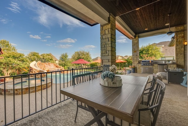 2800 Crystal Falls Pkwy, Leander, TX 78641 - view of patio with exterior kitchen, outdoor dining space, and a pool with connected hot tub