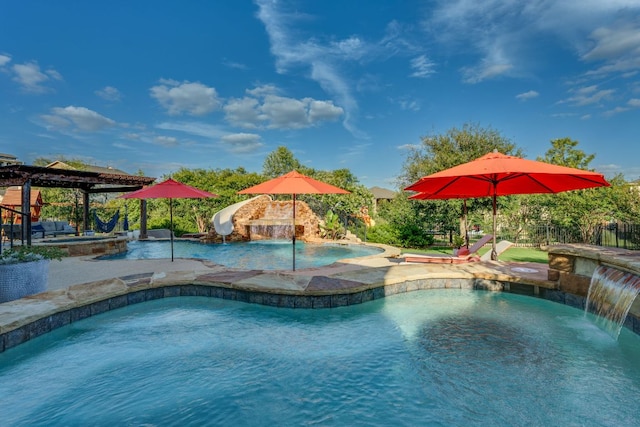 2800 Crystal Falls Pkwy, Leander, TX 78641 - outdoor pool with an in-ground hot tub, a water slide, and a patio