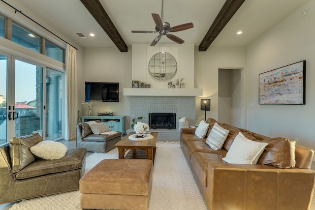 2800 Crystal Falls Pkwy, Leander, TX 78641 - living area with beamed ceiling, ceiling fan, a brick fireplace, and recessed lighting