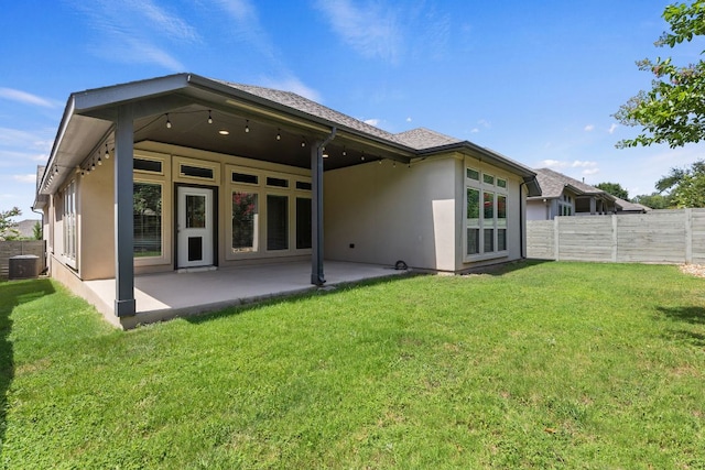 3604 Mercer Rd, Georgetown, TX 78628 - rear view of house with stucco siding and a patio