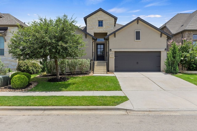 3604 Mercer Rd, Georgetown, TX 78628 - french country style house with a front lawn, concrete driveway, stucco siding, and stone siding