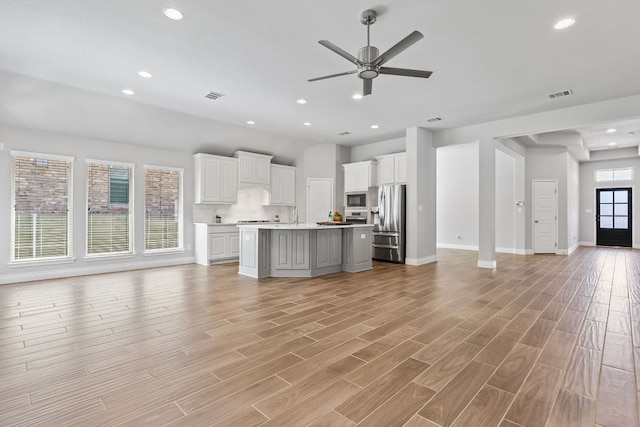 3604 Mercer Rd, Georgetown, TX 78628 - unfurnished living room with a ceiling fan, recessed lighting, and light wood-style flooring