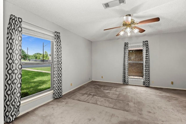 2403 N Shields Dr, Austin, TX 78727 - carpeted spare room with ceiling fan and a textured ceiling