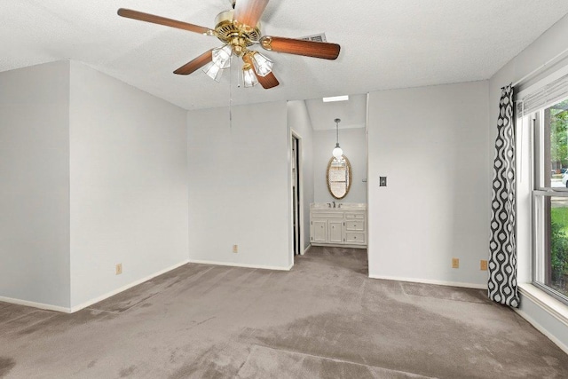 2403 N Shields Dr, Austin, TX 78727 - carpeted spare room featuring a ceiling fan and a textured ceiling