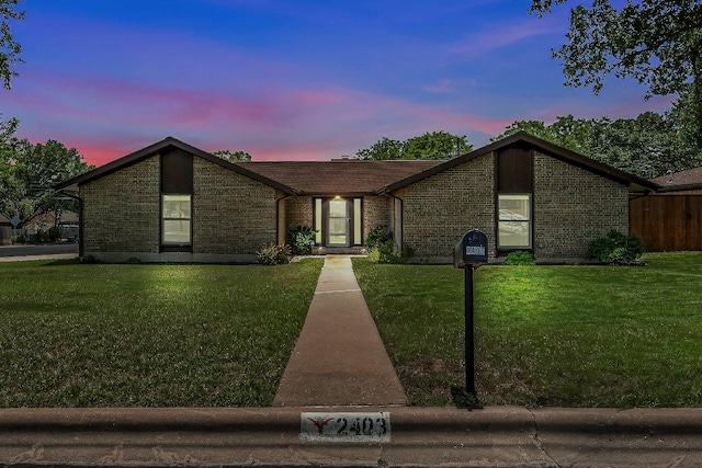 2403 N Shields Dr, Austin, TX 78727 - mid-century inspired home with a yard and brick siding