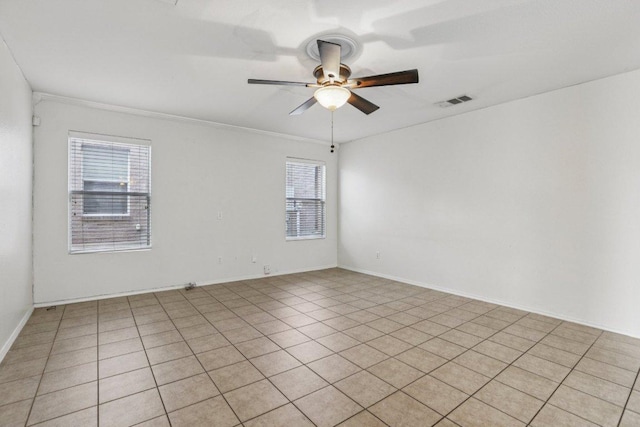 13413 Lismore Ln, Pflugerville, TX 78660 - empty room with a ceiling fan, crown molding, and light tile patterned floors