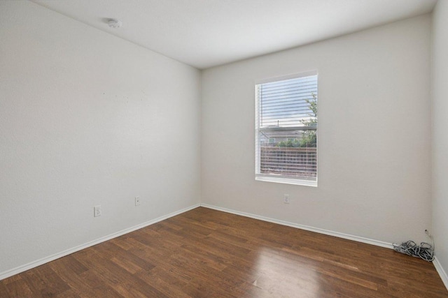 13413 Lismore Ln, Pflugerville, TX 78660 - spare room featuring dark wood finished floors and a smoke detector
