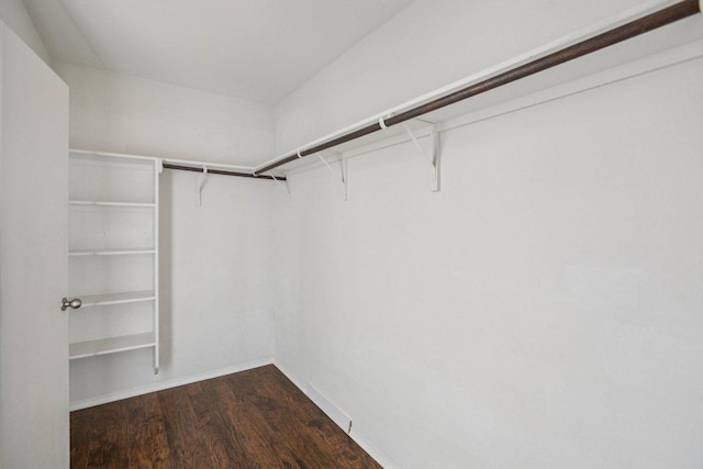 13413 Lismore Ln, Pflugerville, TX 78660 - walk in closet with dark wood-type flooring