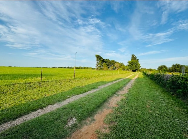 702 Pleasant Grove Rd, Elgin, TX 78621 - surrounding community with dirt driveway and a view of countryside