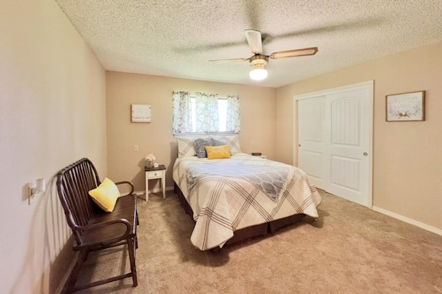 702 Pleasant Grove Rd, Elgin, TX 78621 - bedroom featuring light carpet, ceiling fan, and a textured ceiling