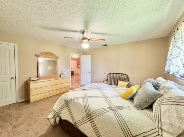 702 Pleasant Grove Rd, Elgin, TX 78621 - bedroom featuring light colored carpet, a textured ceiling, and ceiling fan