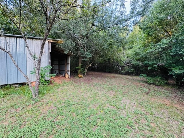 702 Pleasant Grove Rd, Elgin, TX 78621 - view of yard featuring an outdoor structure