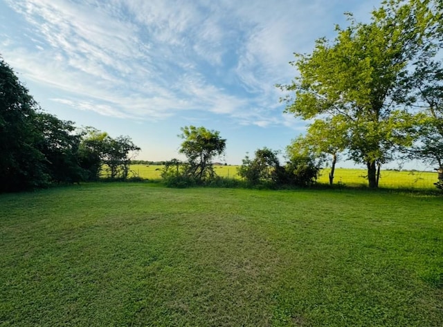 702 Pleasant Grove Rd, Elgin, TX 78621 - view of grassy yard with a view of countryside