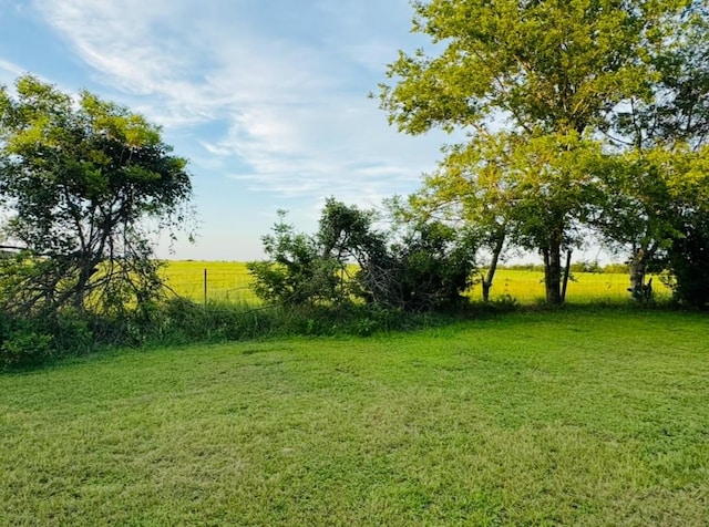 702 Pleasant Grove Rd, Elgin, TX 78621 - view of green lawn featuring a rural view