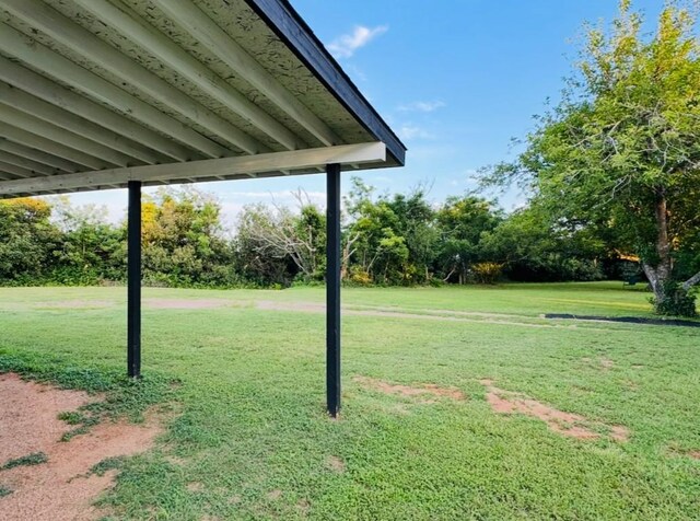 702 Pleasant Grove Rd, Elgin, TX 78621 - view of grassy yard featuring view of scattered trees