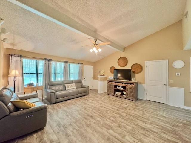 702 Pleasant Grove Rd, Elgin, TX 78621 - living area with a textured ceiling, ceiling fan, and wood finished floors