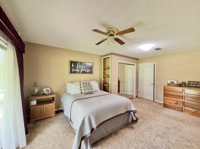702 Pleasant Grove Rd, Elgin, TX 78621 - bedroom featuring carpet, a textured ceiling, and ceiling fan