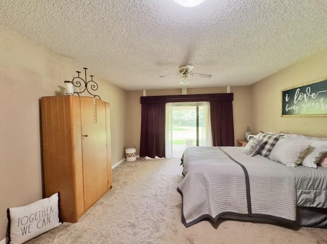 702 Pleasant Grove Rd, Elgin, TX 78621 - bedroom with carpet flooring, a ceiling fan, and a textured ceiling