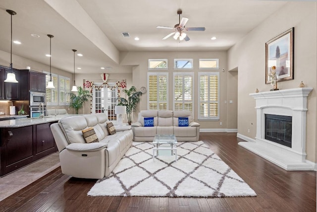 14405 Laurinburg Dr, Austin, TX 78717 - living area featuring a ceiling fan, dark wood finished floors, a glass covered fireplace, and recessed lighting