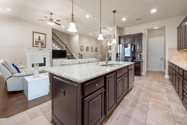 14405 Laurinburg Dr, Austin, TX 78717 - kitchen with stainless steel appliances, backsplash, a ceiling fan, dark brown cabinetry, and recessed lighting