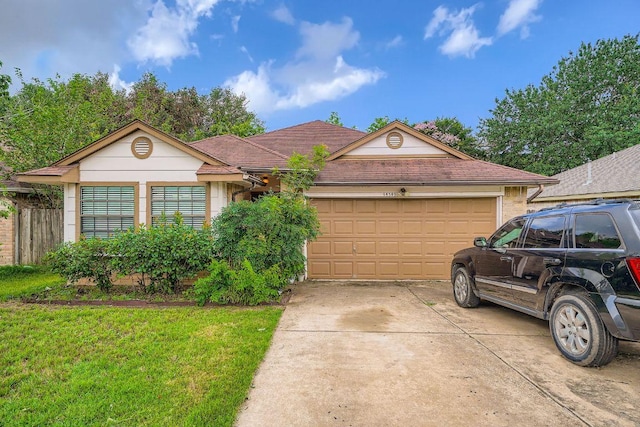 14305 Vandever St, Austin, TX 78725 - ranch-style house featuring an attached garage, concrete driveway, a front lawn, stucco siding, and a shingled roof
