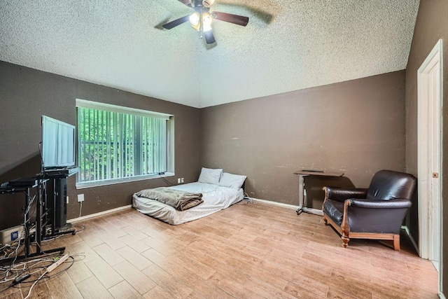 14305 Vandever St, Austin, TX 78725 - bedroom with a textured ceiling, wood finished floors, vaulted ceiling, and ceiling fan