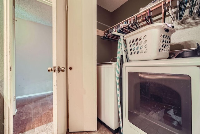 14305 Vandever St, Austin, TX 78725 - washroom featuring washing machine and dryer and baseboards