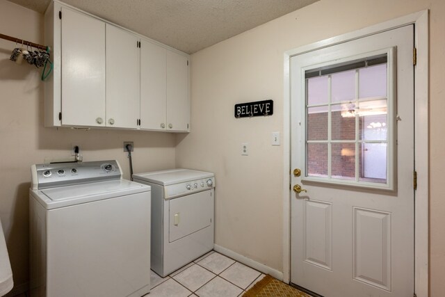 507 Flamingo Cir, Marble Falls, TX 78654 - laundry area featuring separate washer and dryer, cabinet space, and light tile patterned floors