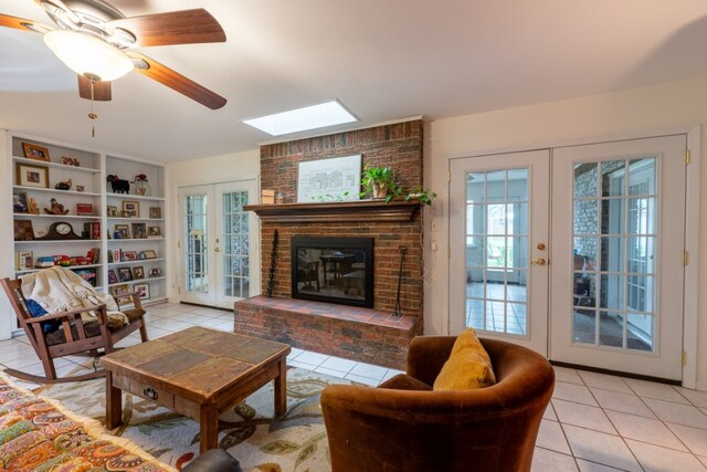 507 Flamingo Cir, Marble Falls, TX 78654 - living area with light tile patterned floors, a skylight, and french doors