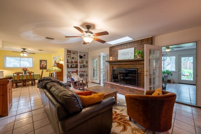 507 Flamingo Cir, Marble Falls, TX 78654 - living area featuring plenty of natural light, a ceiling fan, and light tile patterned flooring